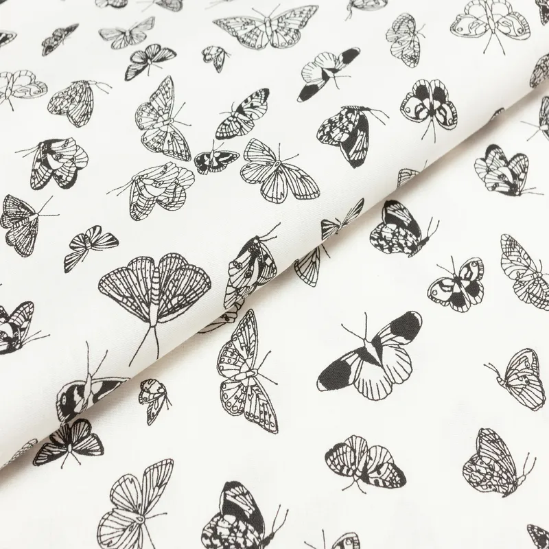 Bavlnená látka Biela s čiernymi motýľmi